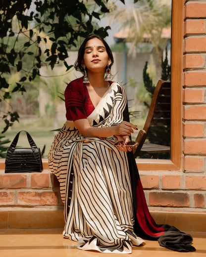 BEAUTIFULL CREAM STRIPTED SAREE WITH RED BINDI PALLU.