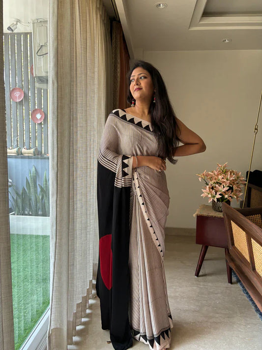 BEAUTIFULL CREAM STRIPTED SAREE WITH RED BINDI PALLU.