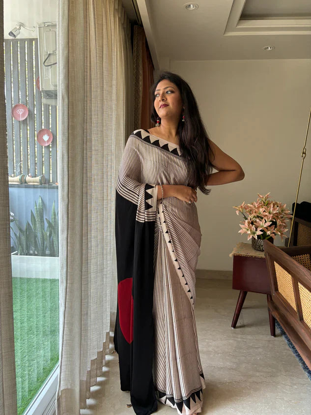BEAUTIFULL CREAM STRIPTED SAREE WITH RED BINDI PALLU.